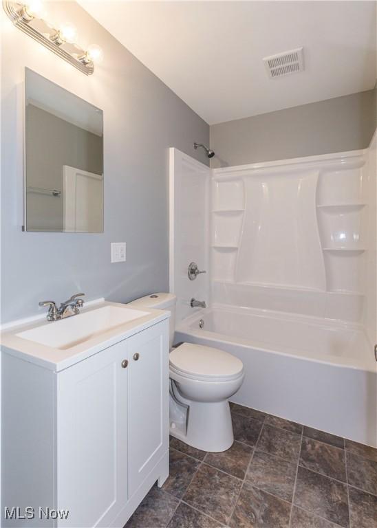 full bathroom featuring vanity, shower / bathing tub combination, and toilet