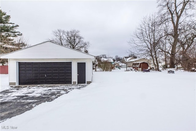 view of snow covered garage