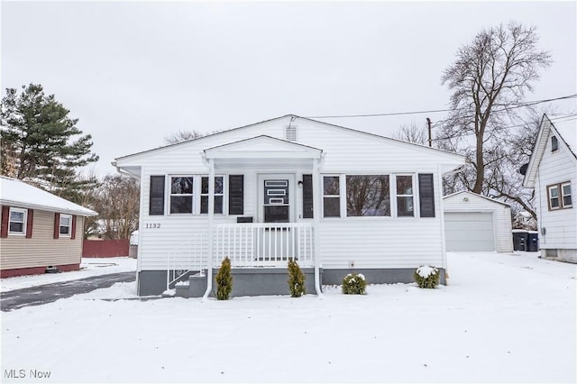 view of front facade with an outdoor structure and a garage