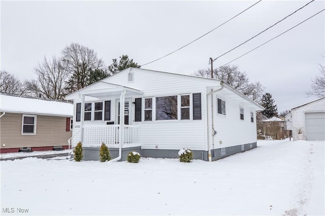 view of front of house with an outbuilding and a garage