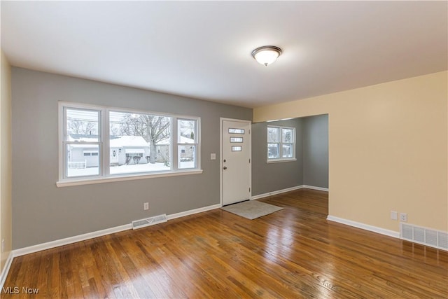 foyer featuring hardwood / wood-style flooring and a healthy amount of sunlight