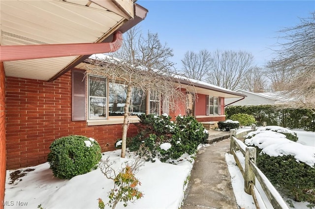 view of snow covered property