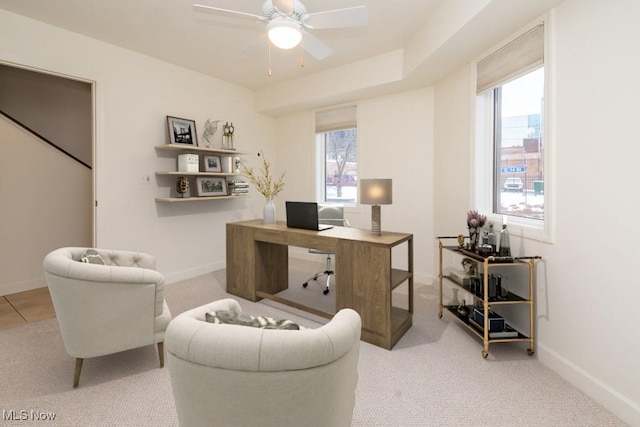 home office featuring baseboards, a ceiling fan, and carpet flooring