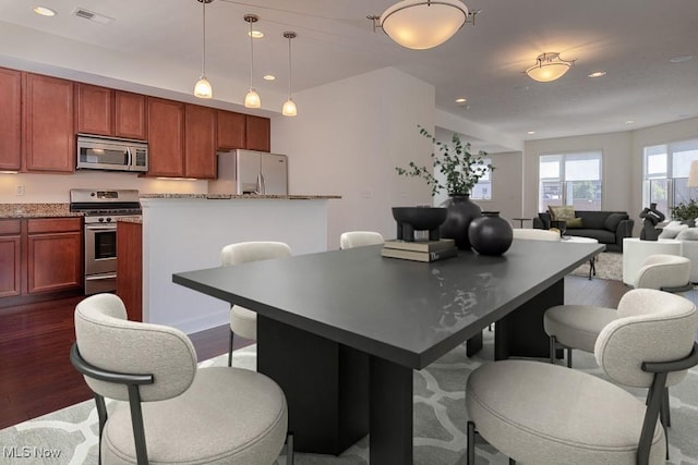 dining area featuring visible vents, recessed lighting, and dark wood-style floors