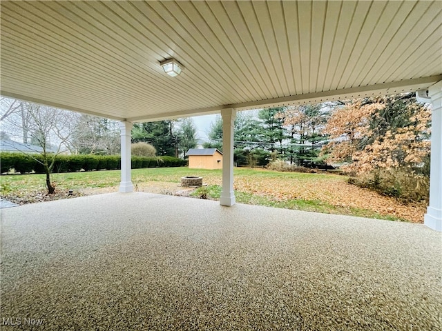 view of patio / terrace featuring an outdoor fire pit