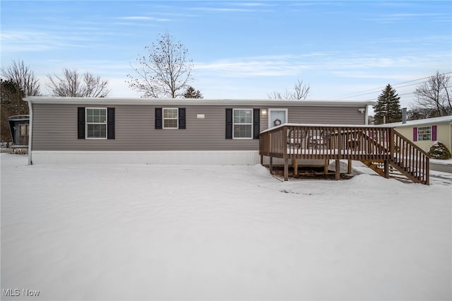 view of front of property with a wooden deck