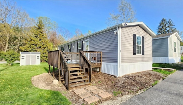 exterior space with a deck, an outdoor structure, a yard, a shed, and stairs