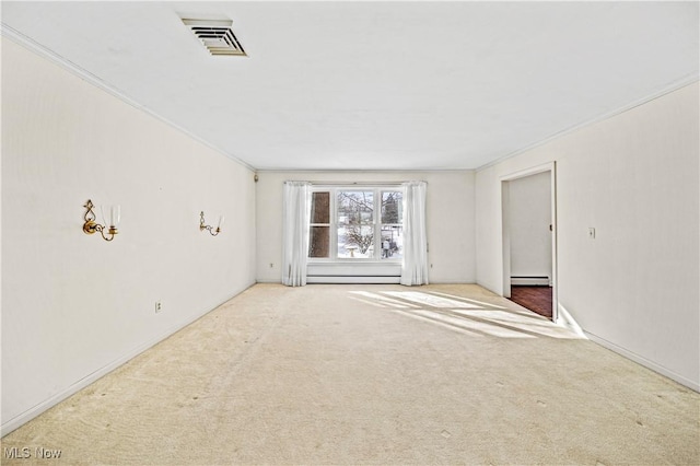 carpeted spare room featuring a baseboard heating unit and ornamental molding