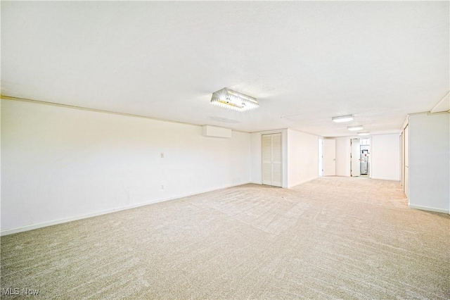 finished basement with light carpet and baseboards