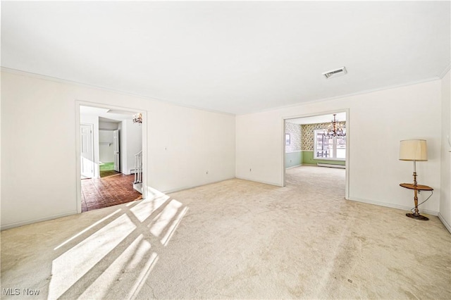 unfurnished room featuring light carpet, a chandelier, and ornamental molding