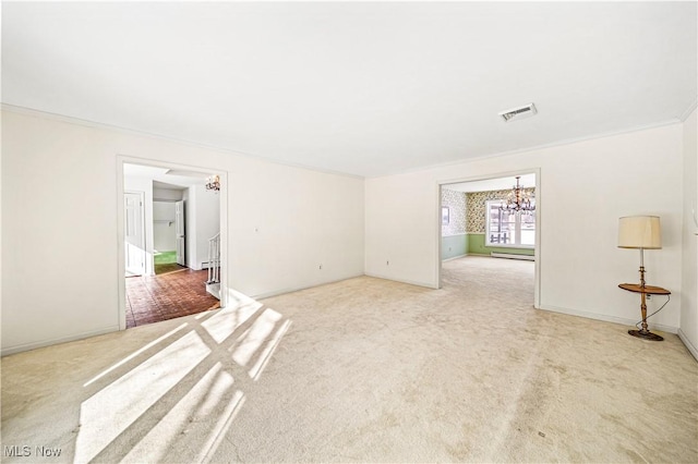 carpeted spare room with a chandelier, baseboards, baseboard heating, and ornamental molding