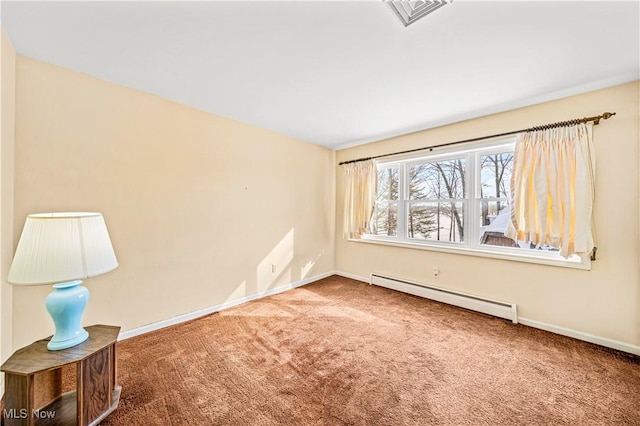 empty room featuring a baseboard heating unit and carpet flooring