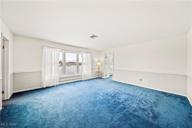 unfurnished room with carpet flooring and baseboards