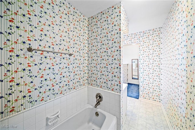 full bathroom featuring wallpapered walls and a bath