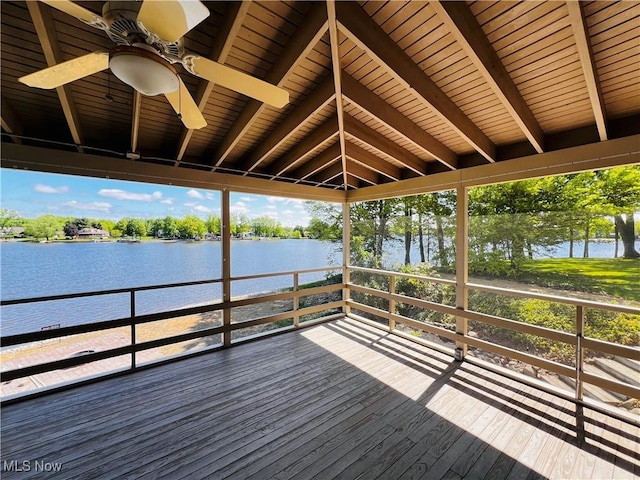 wooden deck with a water view and a ceiling fan