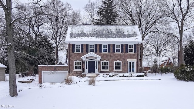 colonial-style house featuring a garage