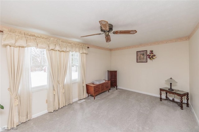 unfurnished room with ceiling fan and light colored carpet