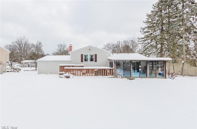 view of snow covered house