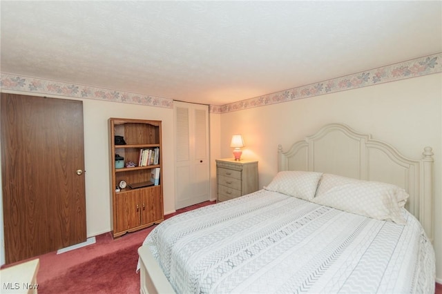 carpeted bedroom featuring a closet