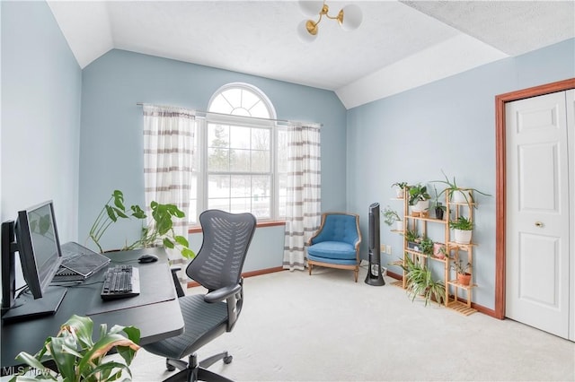 home office with light colored carpet and lofted ceiling