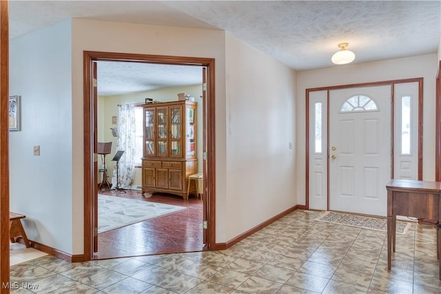 entrance foyer featuring a textured ceiling