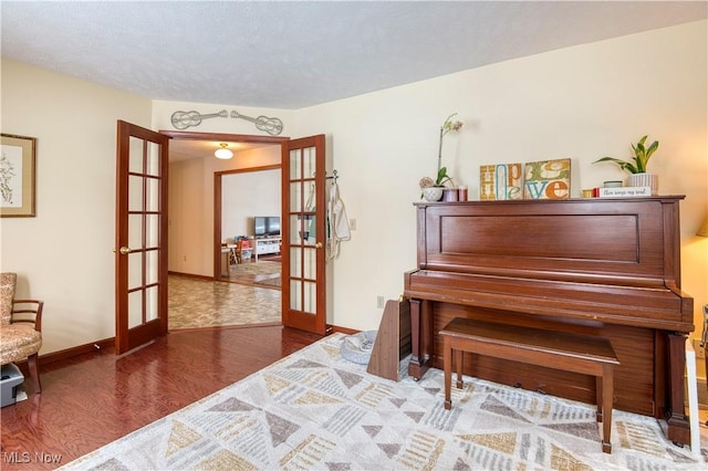 misc room with wood-type flooring and french doors