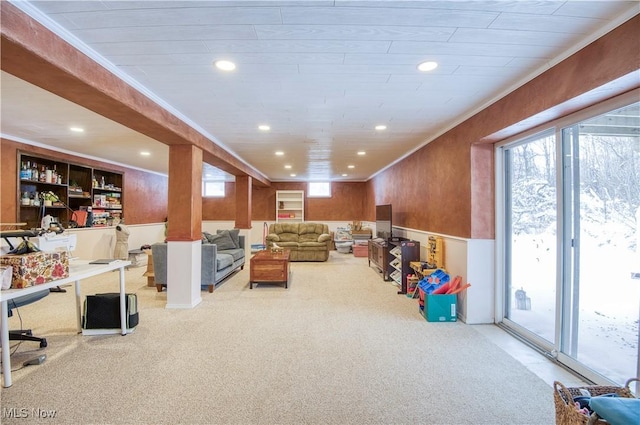 living room with crown molding and light carpet