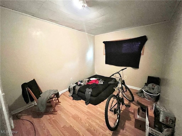 interior space featuring hardwood / wood-style flooring and crown molding