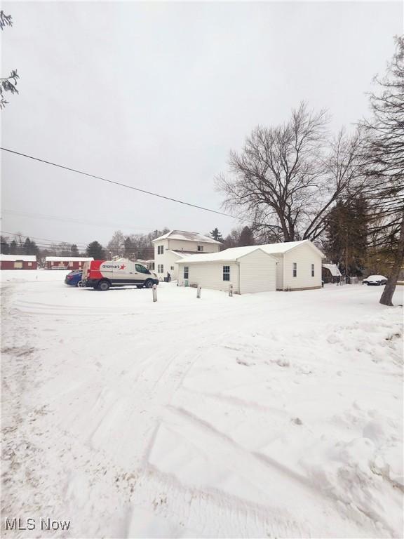 view of yard covered in snow