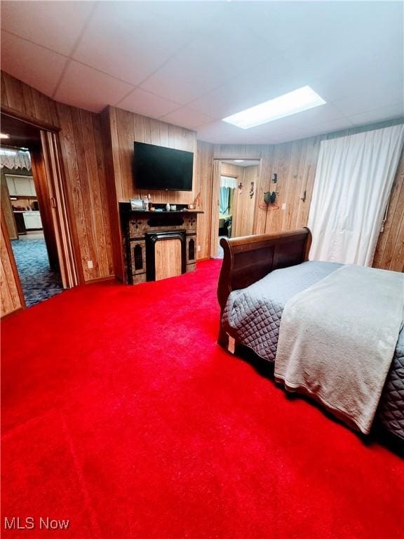 bedroom with wood walls