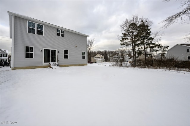 view of snow covered house