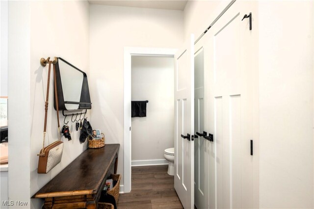 hallway with dark wood-type flooring