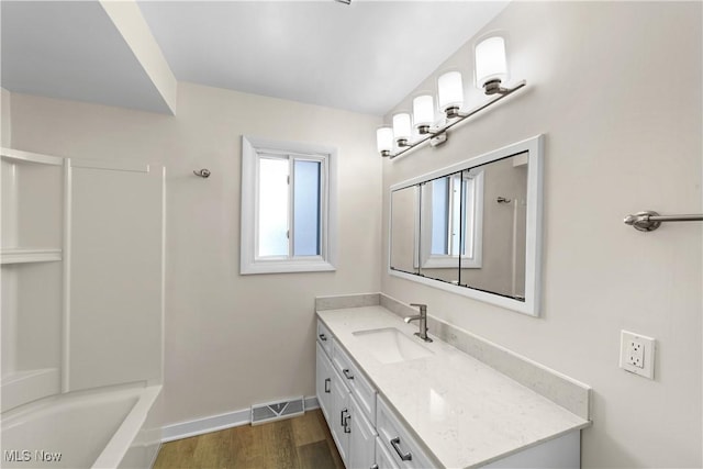 bathroom with hardwood / wood-style floors and vanity