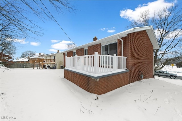 view of snow covered house