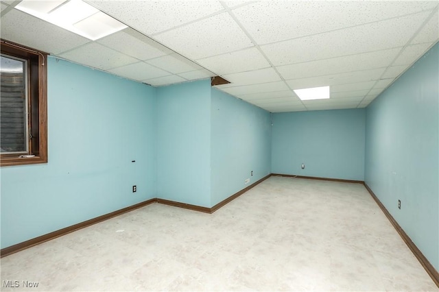 empty room featuring a drop ceiling