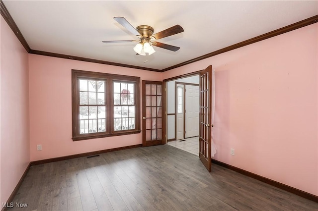 spare room featuring french doors, ceiling fan, ornamental molding, and hardwood / wood-style floors