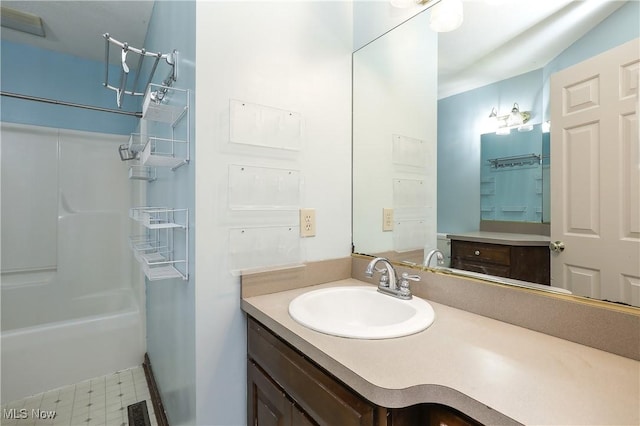 bathroom featuring vanity and shower / bathtub combination