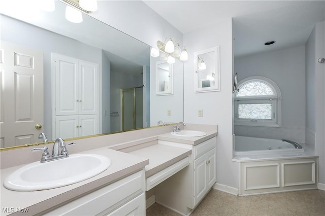 bathroom with vanity and separate shower and tub