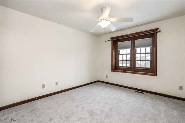 carpeted empty room with ceiling fan