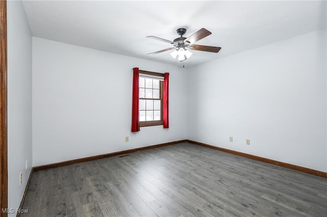 unfurnished room with ceiling fan and hardwood / wood-style floors