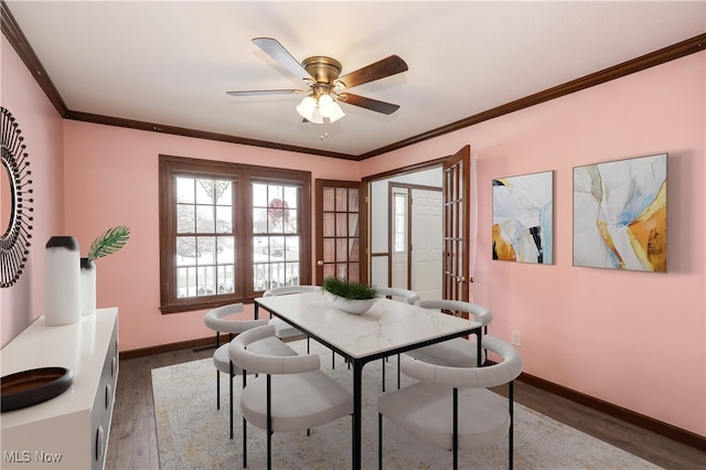 dining area with ceiling fan, french doors, dark hardwood / wood-style floors, and ornamental molding