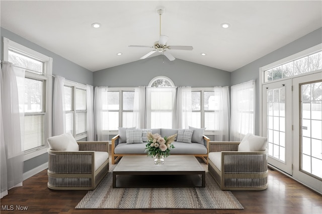 sunroom with ceiling fan, a healthy amount of sunlight, and lofted ceiling