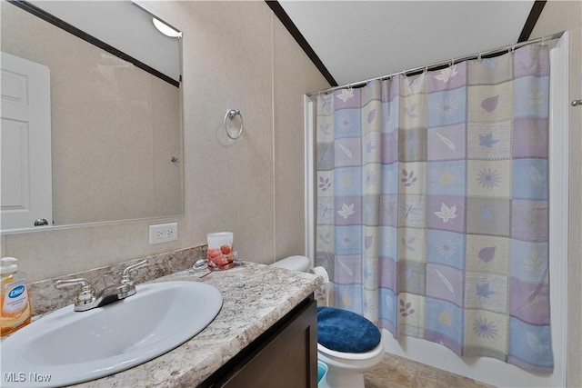 full bathroom featuring shower / bath combination with curtain, vaulted ceiling, toilet, vanity, and ornamental molding