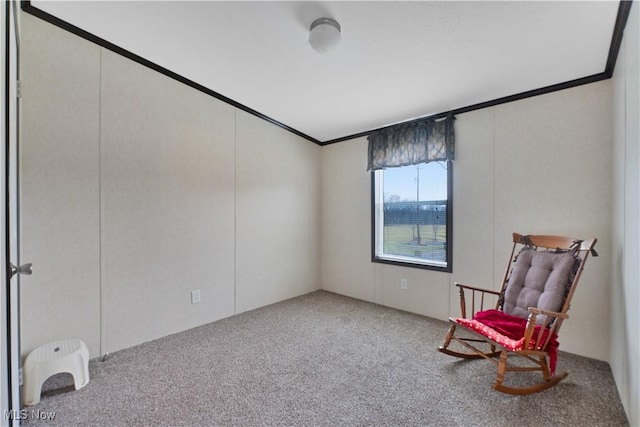 sitting room featuring light carpet and crown molding