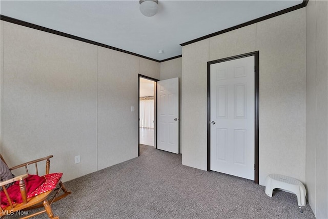 living area with carpet flooring and crown molding