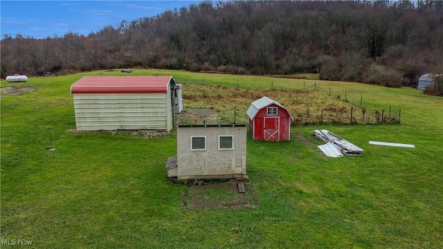 exterior space featuring a shed and a yard