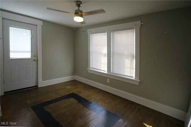 entrance foyer featuring ceiling fan and dark wood-type flooring