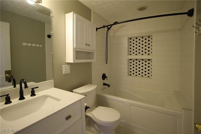 full bathroom featuring vanity,  shower combination, toilet, and a textured ceiling