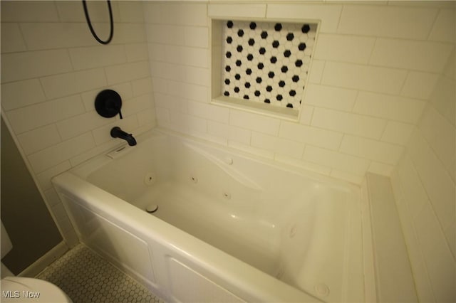 bathroom featuring tile patterned floors and toilet