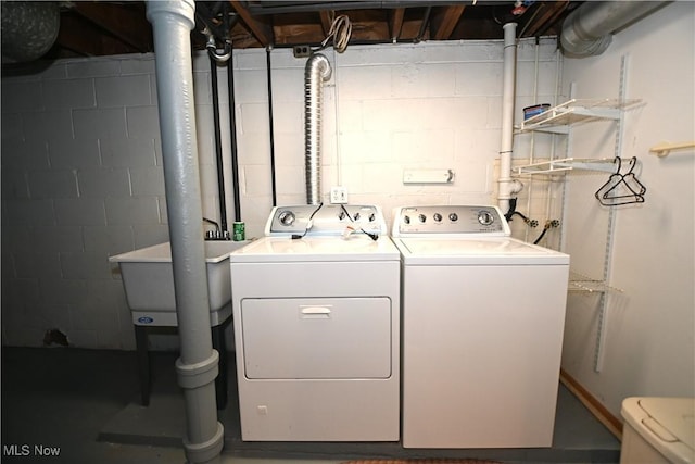 washroom with independent washer and dryer